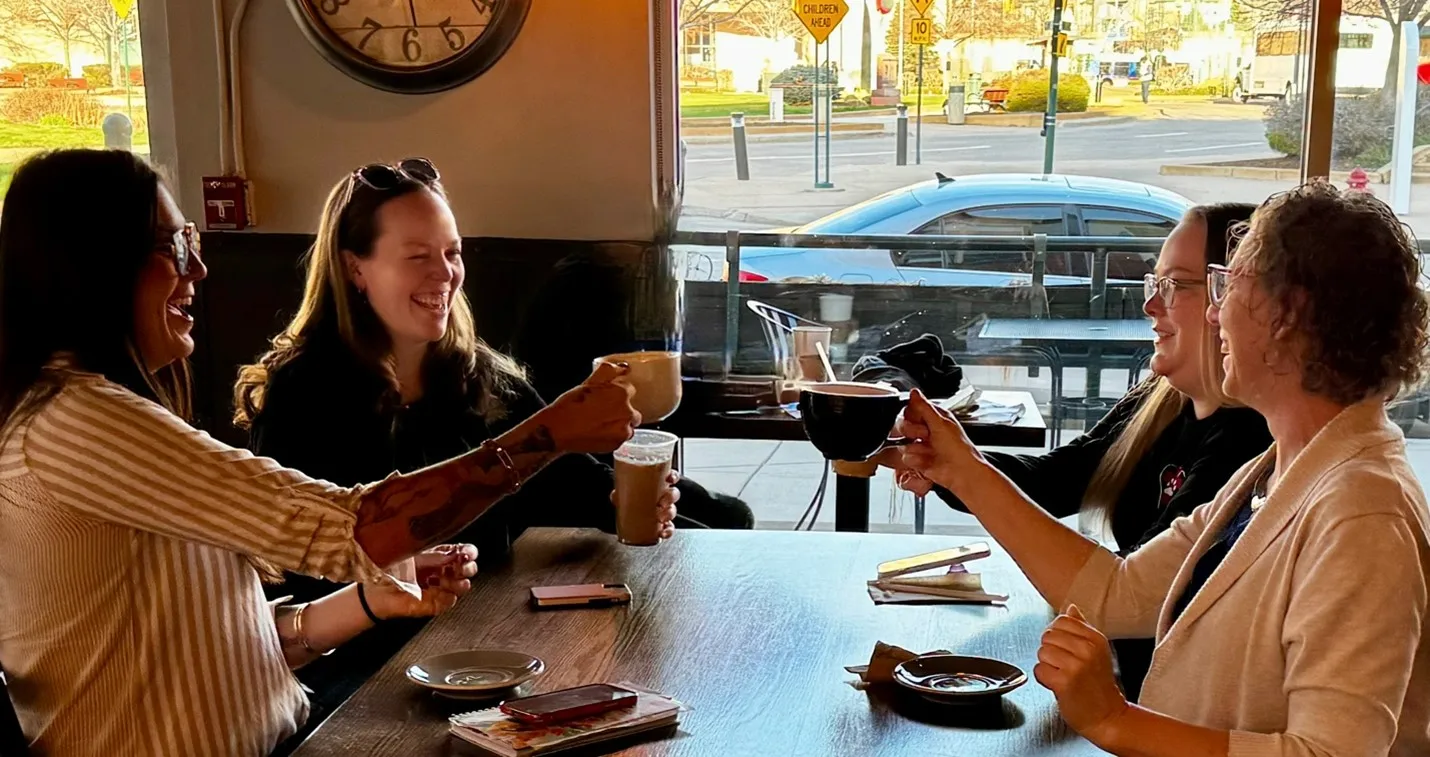 VetChat Live Local - veterinarian meeting in-person in a coffee shop to discuss their careers.